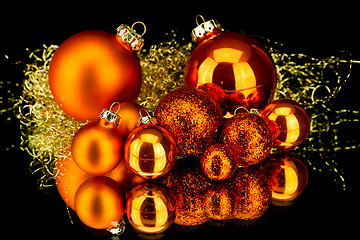 Image showing christmas decoration in orange on black