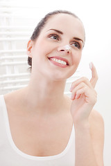 Image showing apllying cream on face skincare