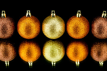 Image showing christmas decoration in orange on black