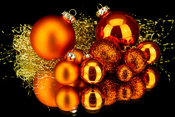 Image showing christmas decoration in orange on black