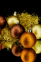 Image showing christmas decoration in orange on black