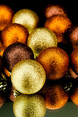 Image showing christmas decoration in orange on black