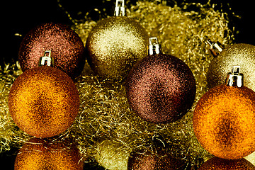 Image showing christmas decoration in orange on black