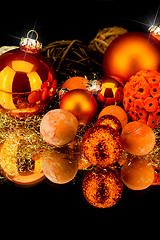 Image showing christmas decoration in orange on black