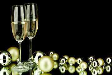 Image showing christmas decoration and champagne on black