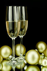 Image showing christmas decoration and champagne on black