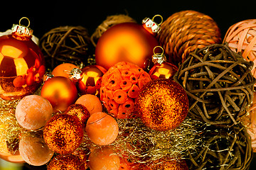 Image showing christmas decoration in orange on black