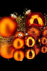 Image showing christmas decoration in orange on black