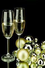 Image showing christmas decoration and champagne on black