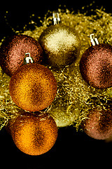 Image showing christmas decoration in orange on black