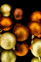 Image showing christmas decoration in orange on black