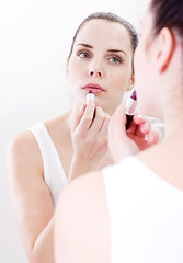 Image showing apllying cream on face skincare