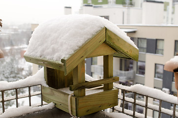 Image showing wooden small house birdie abundant snow roof  