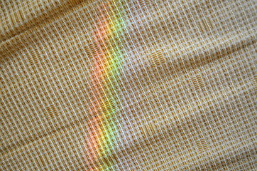 Image showing artificial rainbow light yellow fabric background 