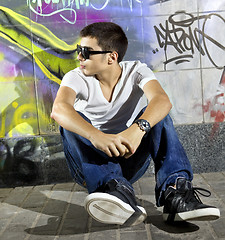 Image showing man in front of graffiti wall