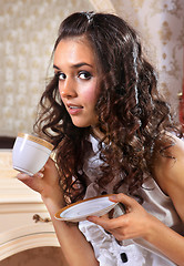 Image showing girl with white tea cup
