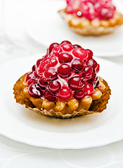 Image showing Cake with a cranberry on a white plate