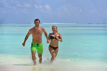 Image showing happy young  couple at summer vacation have fun and relax at bea