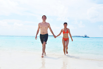 Image showing happy young couple have fun on beach