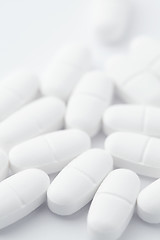 Image showing White pills on white