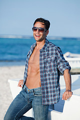 Image showing Man wearing sunglasses and enjoying on the beach