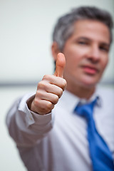 Image showing Businessman gesturing thumbs up sign