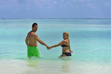 Image showing happy young  couple at summer vacation have fun and relax at bea