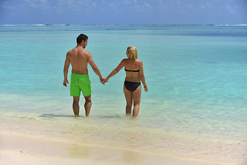 Image showing happy young  couple at summer vacation have fun and relax at bea