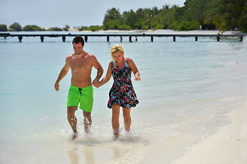 Image showing happy young  couple at summer vacation have fun and relax at bea