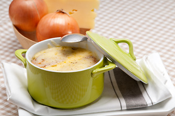 Image showing onion soup with melted cheese and bread on top