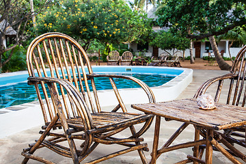 Image showing Chairs on swimming pool border