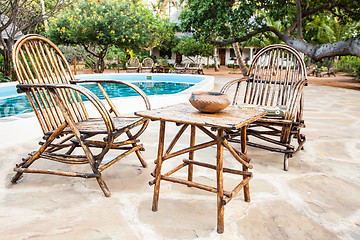 Image showing Chairs on swimming pool border