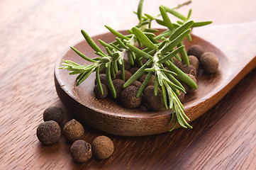 Image showing allspice with fresh rosemary