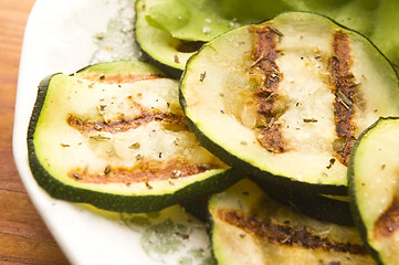 Image showing Grilled organic zucchini slices with herbs and spices