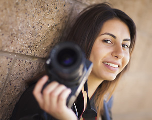 Image showing Mixed Race Young Adult Female Photographer Holding Camera