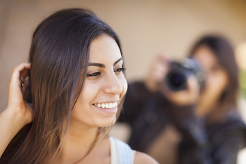 Image showing Young Adult Mixed Race Female Model Poses for Photographer