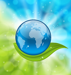 Image showing Planet earth with green leaf