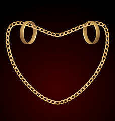 Image showing Jewelry two rings on golden chain of heart shape