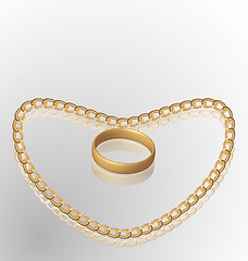 Image showing Jewelry ring on golden chain of heart shape