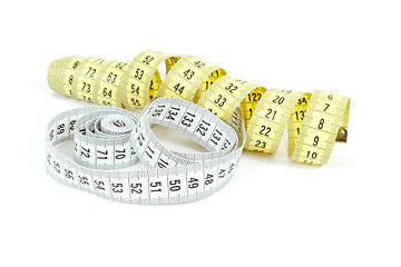 Image showing Yellow and white measuring tape isolated on white