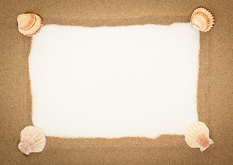 Image showing sea shells with sand and white paper as background 