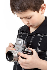 Image showing young boy with old vintage analog SLR camera