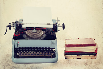 Image showing Old typewriter with books retro colors on the desk