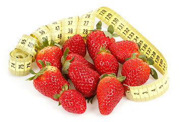 Image showing Measuring tape around a strawberry as a symbol of diet