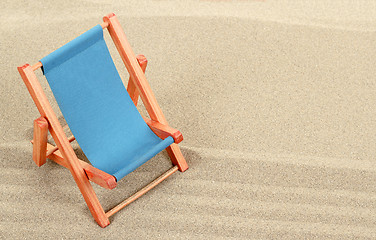 Image showing Vacation background with sun lounger