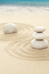 Image showing Balance zen stones in sand with sea in background