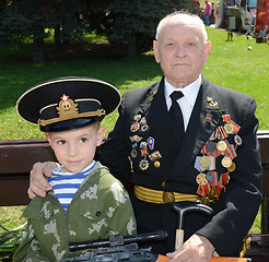 Image showing Grandfather and grandson on Victory Day