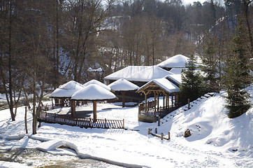 Image showing frozen river bay water wooden house bank roof snow 