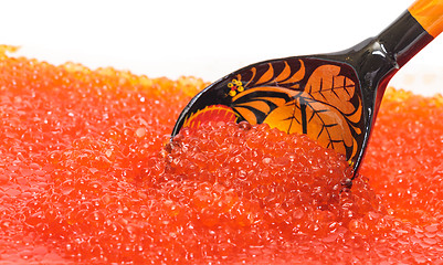 Image showing Red salted caviar with wooden spoon