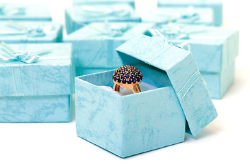 Image showing Cyan gift boxes with ring